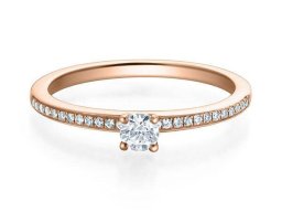 brillant  solitar mit seitlichem besatz kanal rotgold